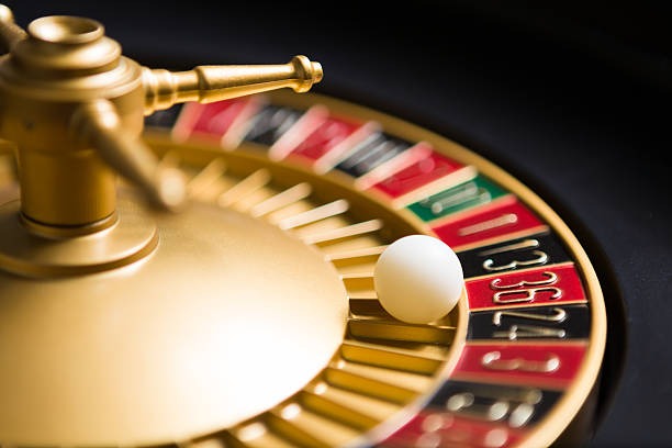 Live dealer blackjack table with cards and chips on felt